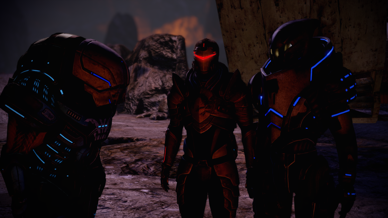 Garrus, Grunt and Shephard in full armor standing together.